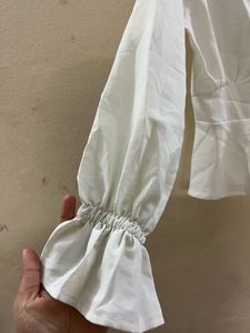 White Peplum Button-Down Top