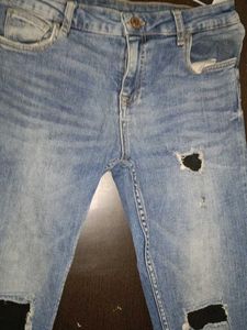 Ripped Knee Jeans