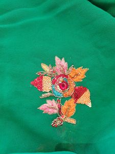 Pure georgette saree in green color  embroidered flower  ?