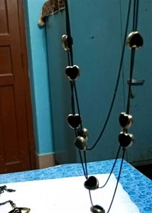 Long Neck Piece And Black Earrings
