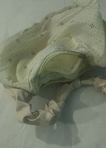 A Beige Side Bag.