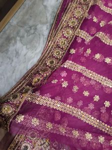 Heavy Work Purple Net Saree With Shiny Petticoat.