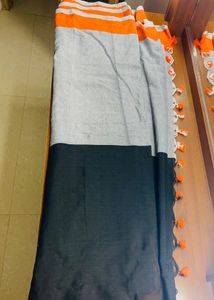 Black orange cotton blend saree with pompoms