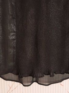 Black sleeveless blouse with lace collar