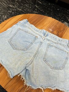 denim with little stains, which are removeable
