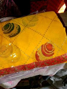 Yellow colored Matka Georgette Saree