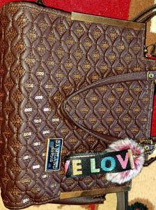 Brown Quilted Handbag with Sequins and Pom-Pom Cha