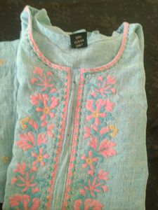 It's a Handworked Kurti.Bottle Green Colour.