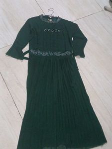 a green color gown having  modern look