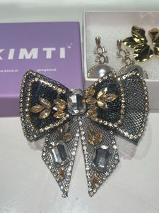 earring and hair bow combo