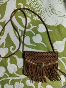 BROWN TASSLED SLING BAG