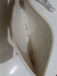 White Purse With Black Stripes And Handle , Length : 19cm , Width: 12 Cm