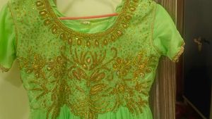 Elegant Green Embroidered Dress with Gold Detailin