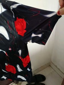 smart black top with red flowers on it
