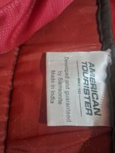 American Tourister Red And Grey Backpack