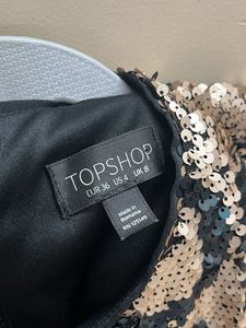Embellished bodycon cold shoulder dress.