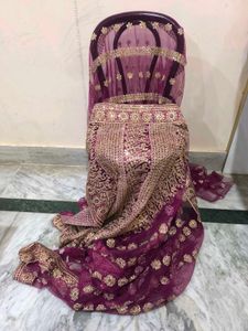 Heavy Work Purple Net Saree With Shiny Petticoat.