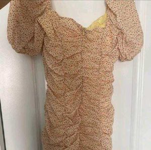 nude floral ruched mini dress with puff sleeves