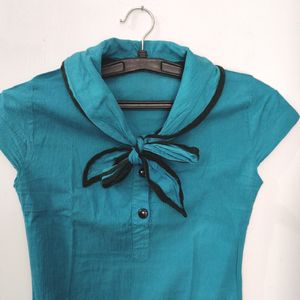 Tunic With A Bow Neck And Pockets