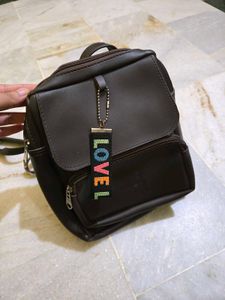 Brown Mini Backpack with Charm