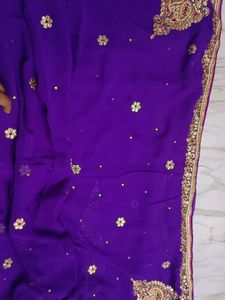 A Purple Blue Saree With Heavy Work