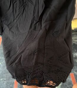 Black Skirt With Beads And Cut Out At Bottom