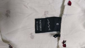 Factorie white mini skirt with a cherry print.