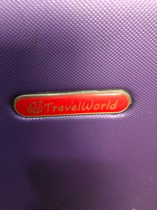 Purple Travelworld Rolling Suitcase
