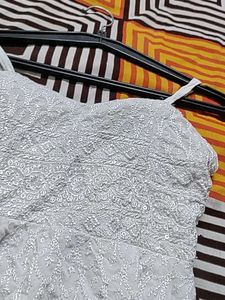 White Embroidered Peplum Top With Padded And Adjus