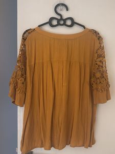 Mustard Top With Netted Hand Design Looks Classy