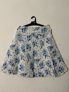 White skirt with a blue floral print