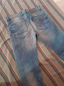 Distressed Light Wash Denim Jeans