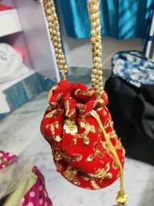 Red embroidery potli