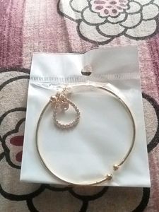 Gold Tone Bangle with Charm