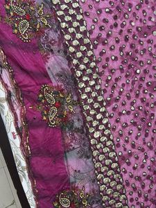 Heavy Purple Stone And Sequin Work Net Saree