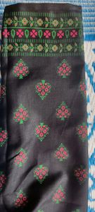 pure cotton black colour long kurta which has red and green printed flowers ..the kurta is unused