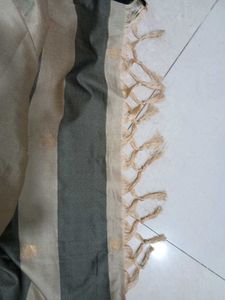 Beige Colour Saree With black &amp; Golden Border.