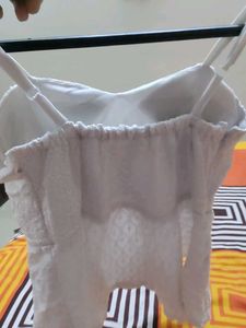 White Embroidered Peplum Top With Padded And Adjus