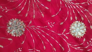 Radiant Red Saree with Intricate Gold Sequins