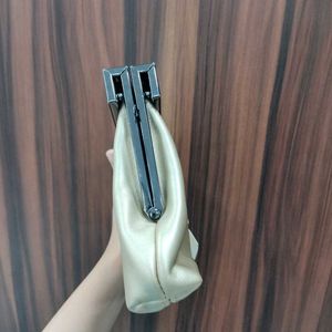 NWT Embelle Gold Cluth With Black Metal Sling