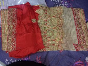 Red Heavy Saree With Golden Blouse.