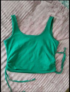 GREEN CROP TOP WITH SIDE STRINGS