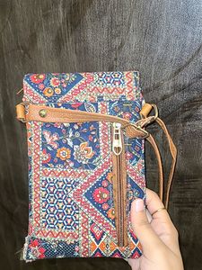 Vibrant Multicolored Sling Bag with Pink Tassels