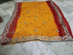 Red and yellow bandhni saree