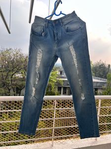 Ripped Light Wash Denim Jeans