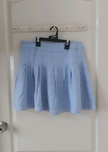 AND blue checkered skirt.