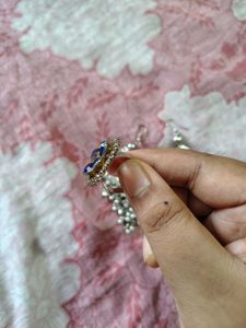 Silver tone bracelet and earrings