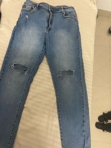 Ripped Knee Light Wash Jeans