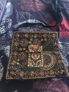 Black color embroided and studded sling bag