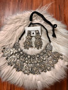 Neckpiece and earrings